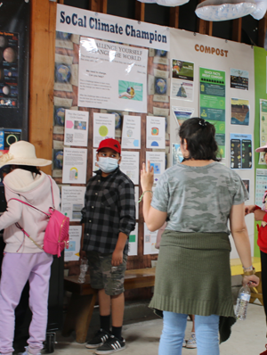 Kids gathered around an educational display at the Skyland Ranch.