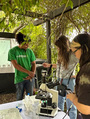 LA Compost staff host a soil health and microscopy workshop for community members at the Carver Middle School Community Garden in South Los Angeles. 