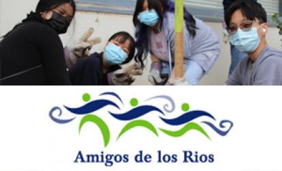 Four students wearing masks and gardening gloves, pose in front of a concrete wall, one holding a shovel. Below the photo is the Amigos De Los Rios logo on white backdrop.