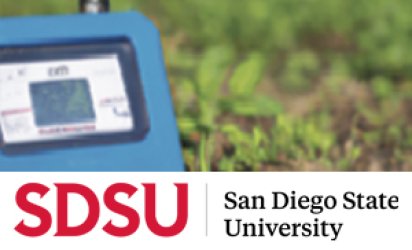 A picture of a blue and black piece of electronic equipment taking readings with a row of green crops behind it. The lower third of the image reveals the San Diego State University logo (SDSU) in red.