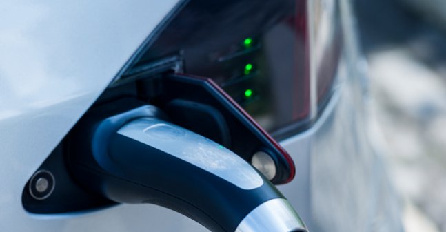 Closeup of an electric car recharging